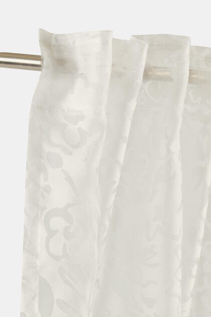 Back tab curtains with floral pattern