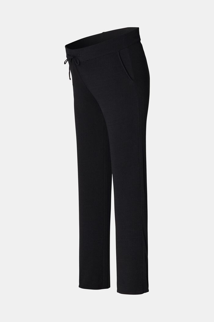 Knitted trousers with under-bump waistband