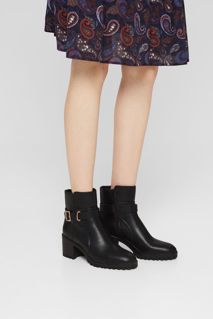 Ankle boots with a buckle in faux leather