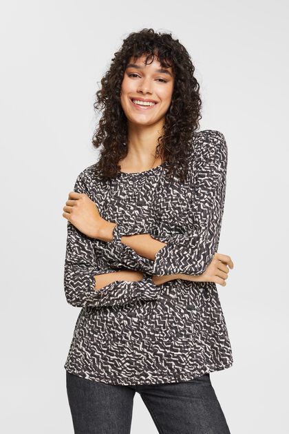 Patterned blouse with cut-out sleeves