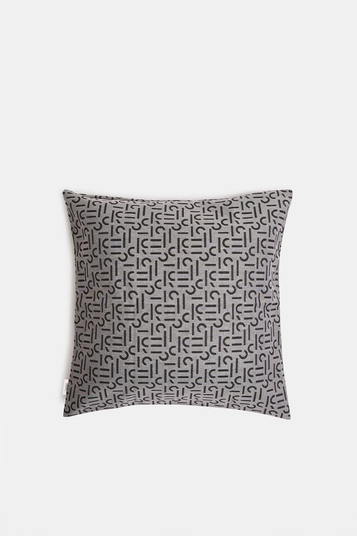 Cushion cover with a woven pattern